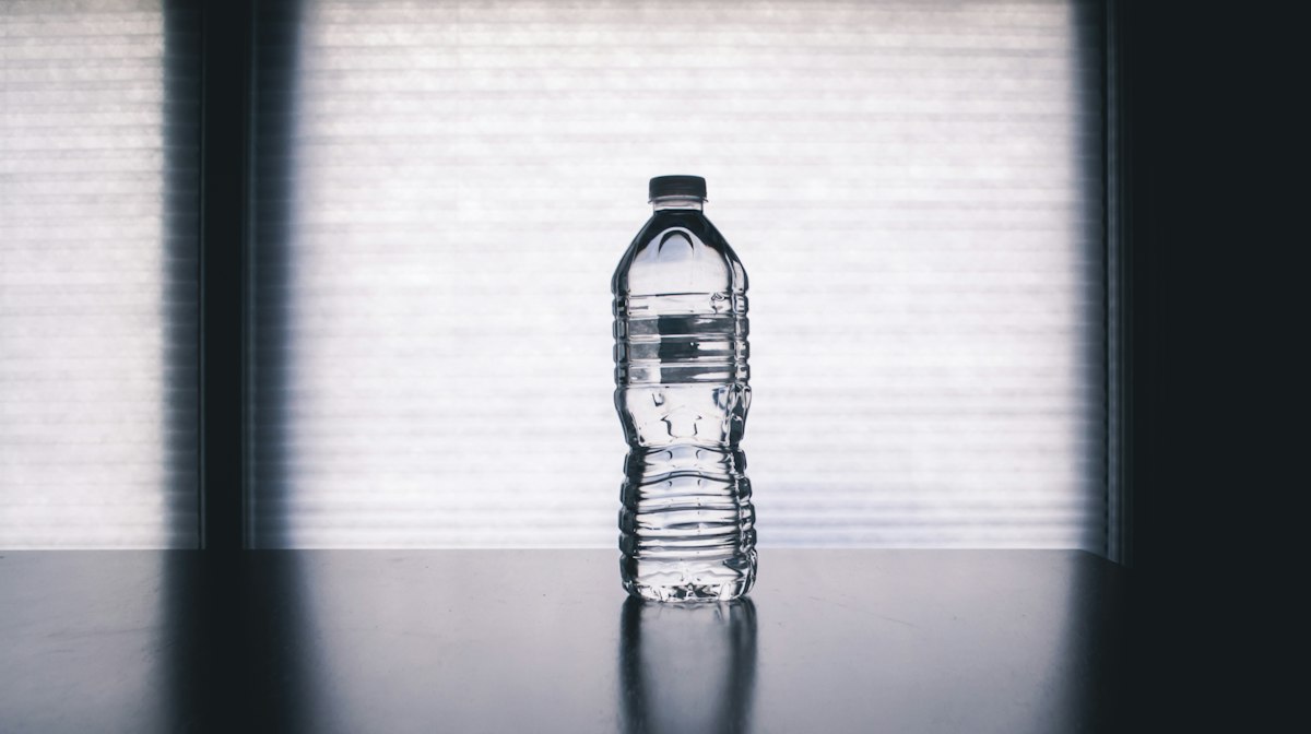 A glass of water representing the critical role of hydration with fibre supplements